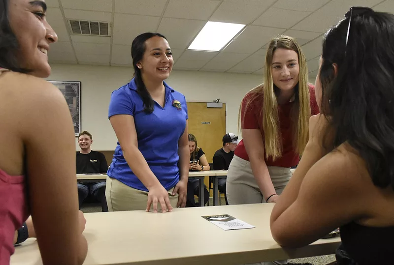 Fresno State Multicultural Ambassadors Jocelyn and Stacy lead a session with high school students. 