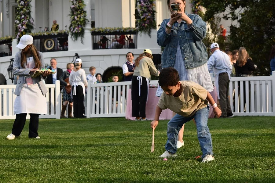 A child rolls eggs in the morning sun.jpg