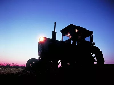 sun-rising-over-tractor-USDA-flickr-photo.jpg