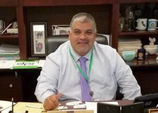 Ruben Arroyo at desk