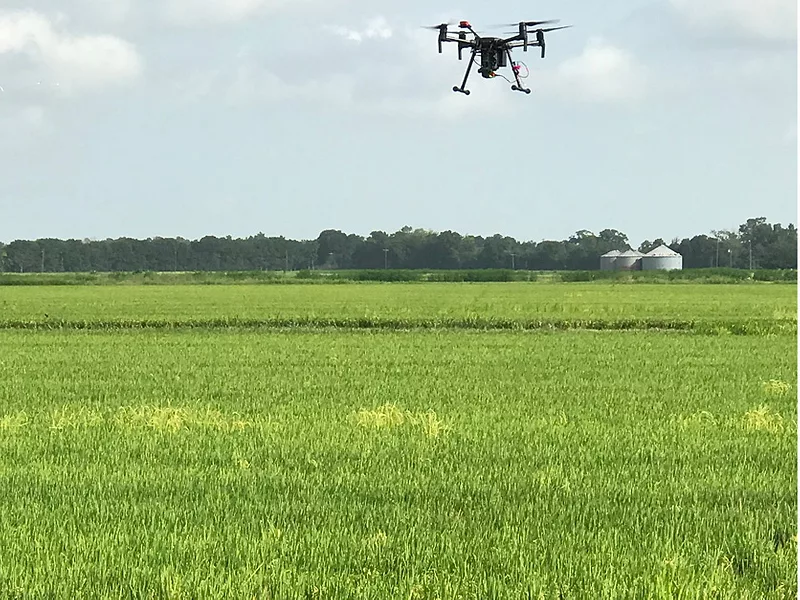 a drone flies over a field