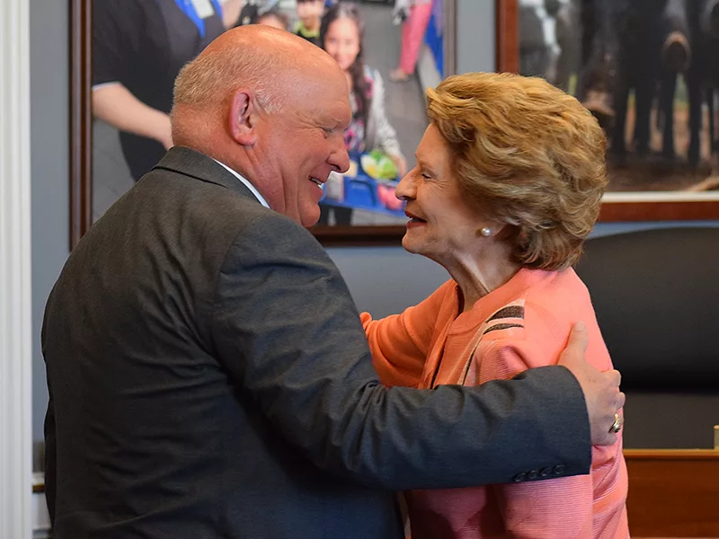 Glenn Thompson and Debbie Stabenow hugging.JPG