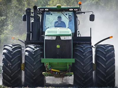 Sonny Perdue driving a tractor