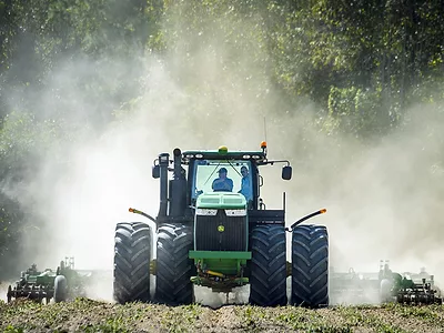 Sonny Perdue driving a tractor