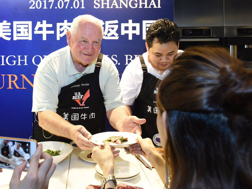 Sonny Perdue China serving beef